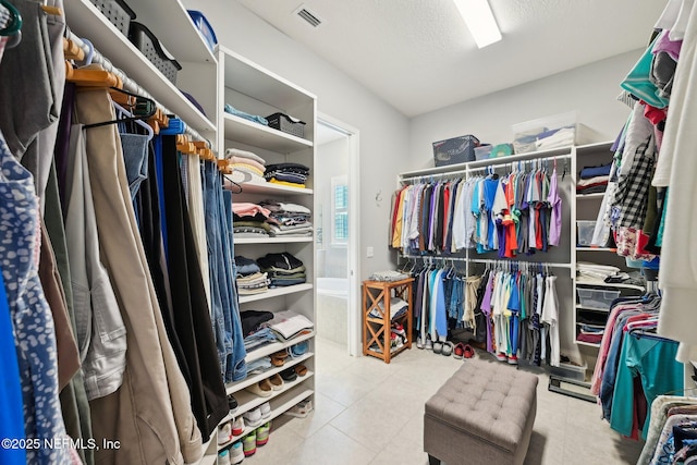 walk in closet featuring visible vents and tile patterned flooring