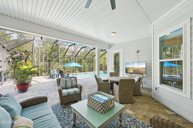 view of patio / terrace featuring an outdoor pool, ceiling fan, outdoor dining area, and glass enclosure