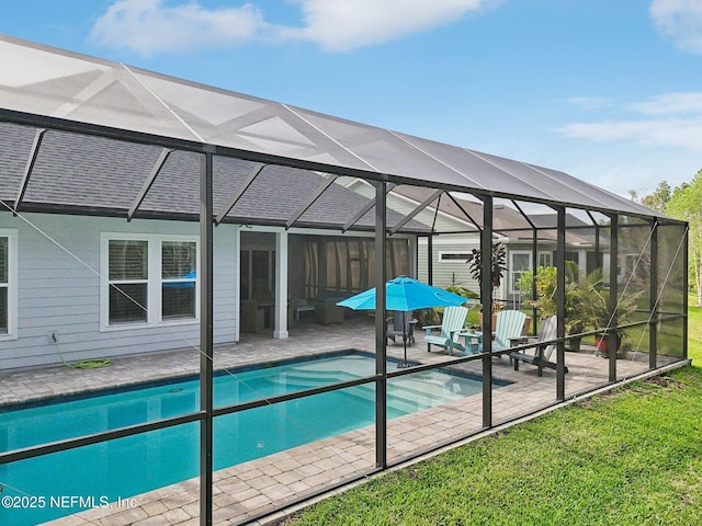 pool with a lanai and a patio area