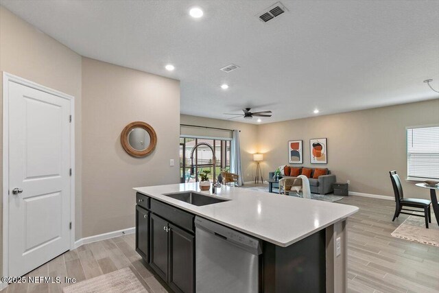 270 King George Ave, Saint Augustine, FL 32092 - kitchen with light wood-type flooring, stainless steel dishwasher, a sink, and visible vents