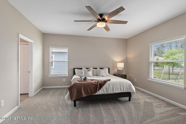 270 King George Ave, Saint Augustine, FL 32092 - bedroom with baseboards, multiple windows, and light colored carpet