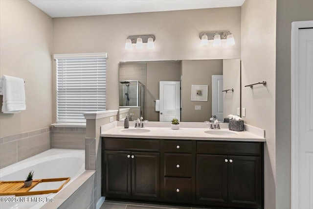 270 King George Ave, Saint Augustine, FL 32092 - bathroom with a stall shower, a garden tub, double vanity, and a sink