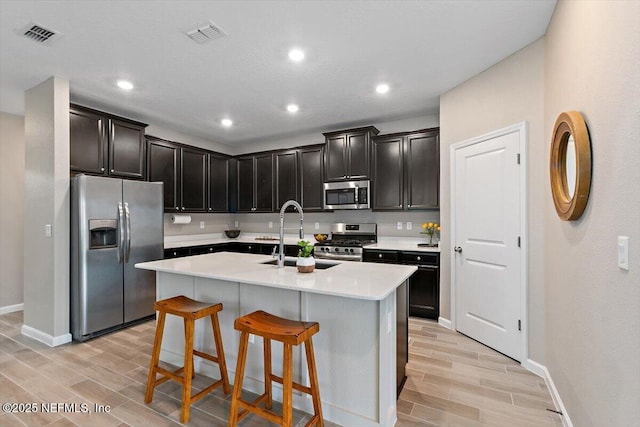 270 King George Ave, Saint Augustine, FL 32092 - kitchen featuring light wood finished floors, baseboards, a sink, and appliances with stainless steel finishes