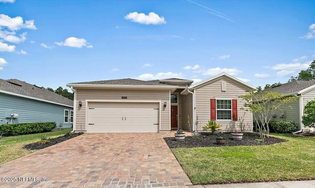 270 King George Ave, Saint Augustine, FL 32092 - single story home featuring a garage, a front lawn, and decorative driveway