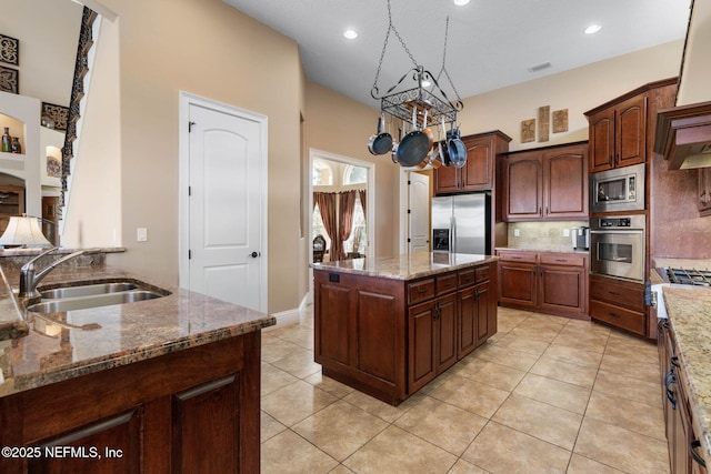 9 Cypresswood Dr, Palm Coast, FL 32137 - kitchen featuring decorative backsplash, a sink, light tile patterned flooring, light stone countertops, and appliances with stainless steel finishes