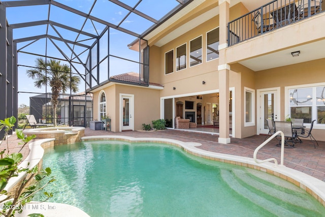 9 Cypresswood Dr, Palm Coast, FL 32137 - view of swimming pool featuring a pool with connected hot tub, a lanai, and a patio