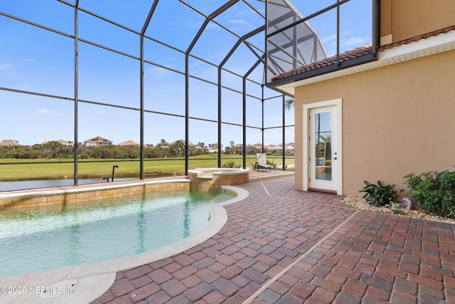 9 Cypresswood Dr, Palm Coast, FL 32137 - view of pool featuring glass enclosure, a pool with connected hot tub, a water view, and a patio