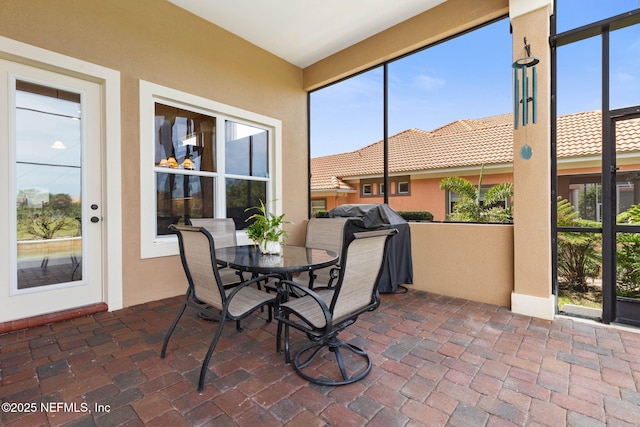 9 Cypresswood Dr, Palm Coast, FL 32137 - sunroom / solarium featuring brick floor
