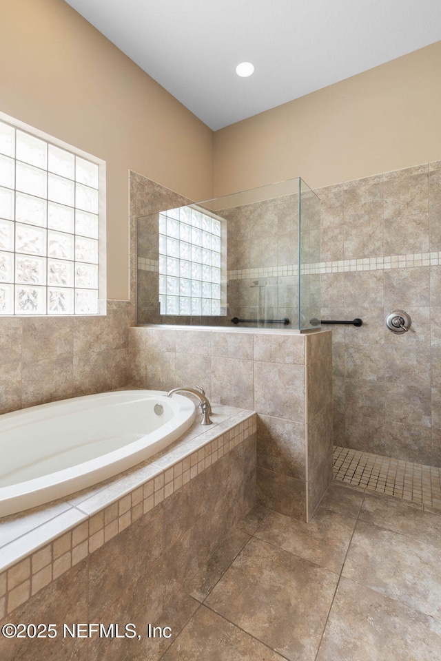 9 Cypresswood Dr, Palm Coast, FL 32137 - bathroom with a garden tub and a walk in shower