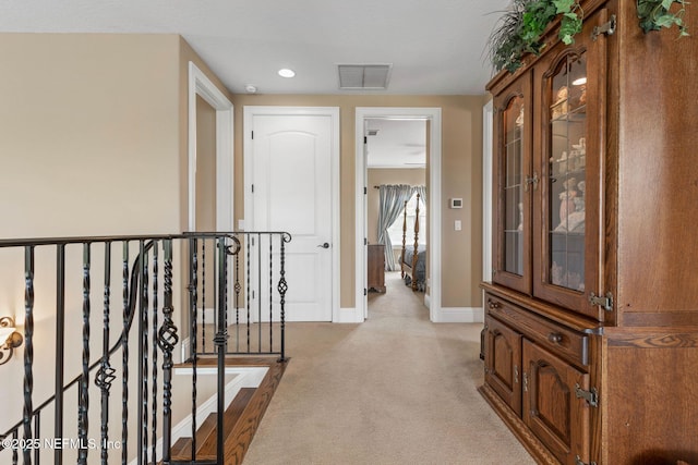 9 Cypresswood Dr, Palm Coast, FL 32137 - corridor with baseboards, an upstairs landing, visible vents, and carpet