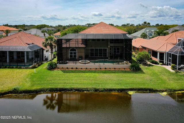 9 Cypresswood Dr, Palm Coast, FL 32137 - rear view of house featuring glass enclosure, a tile roof, a lawn, and an outdoor pool