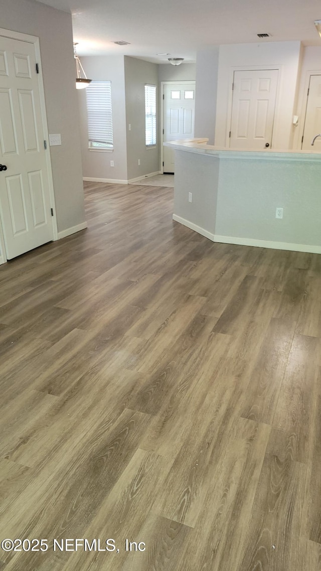 8550 Argyle Business Loop Unit 1308, Jacksonville, FL 32244 - spare room featuring wood finished floors and baseboards
