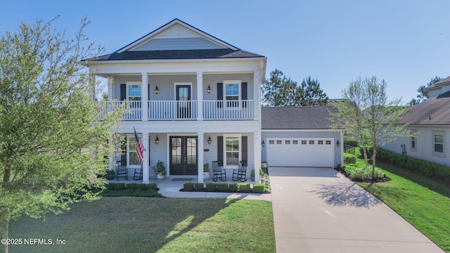 211 Bronson Pkwy, Saint Augustine, FL 32095 - greek revival inspired property with covered porch, french doors, concrete driveway, a front lawn, and a garage