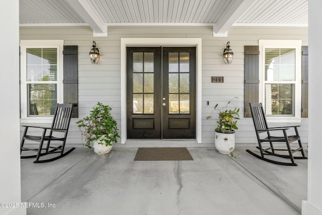 211 Bronson Pkwy, Saint Augustine, FL 32095 - entrance to property with a porch and french doors