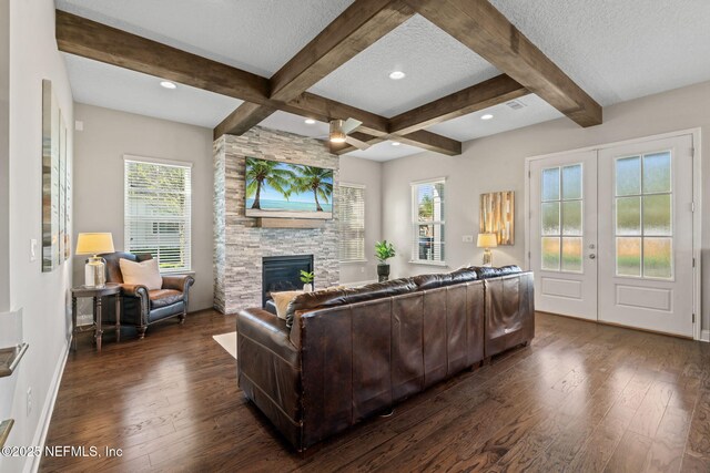 211 Bronson Pkwy, Saint Augustine, FL 32095 - living area featuring dark wood-style flooring, beam ceiling, and a textured ceiling