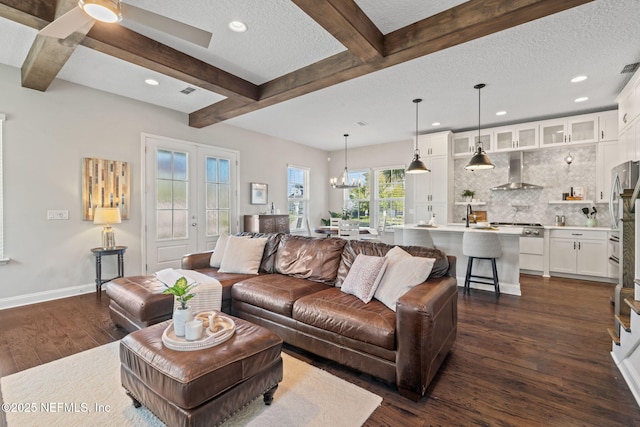 211 Bronson Pkwy, Saint Augustine, FL 32095 - living room with recessed lighting, baseboards, a textured ceiling, dark wood finished floors, and beamed ceiling