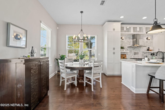 211 Bronson Pkwy, Saint Augustine, FL 32095 - dining room featuring recessed lighting, an inviting chandelier, baseboards, dark wood-style floors, and visible vents