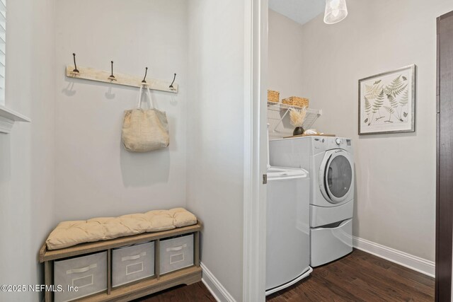 211 Bronson Pkwy, Saint Augustine, FL 32095 - laundry area featuring washing machine and clothes dryer, baseboards, laundry area, and dark wood finished floors