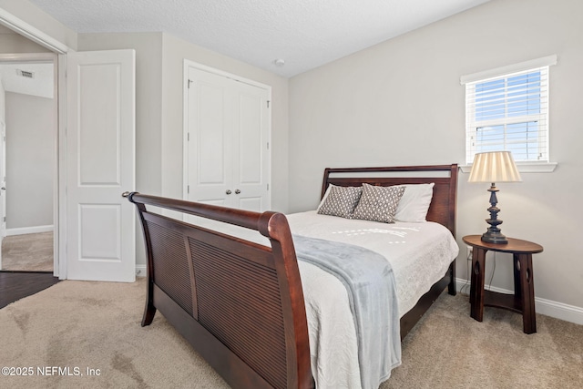 211 Bronson Pkwy, Saint Augustine, FL 32095 - carpeted bedroom featuring baseboards, visible vents, a closet, and a textured ceiling