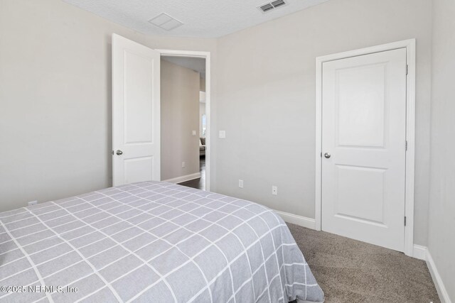 211 Bronson Pkwy, Saint Augustine, FL 32095 - carpeted bedroom with a textured ceiling, baseboards, and visible vents