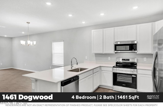 9048 Whinny Way, Jacksonville, FL 32219 - kitchen featuring appliances with stainless steel finishes, white cabinetry, a peninsula, and recessed lighting