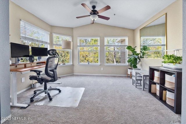 office space with baseboards, ceiling fan, vaulted ceiling, and carpet