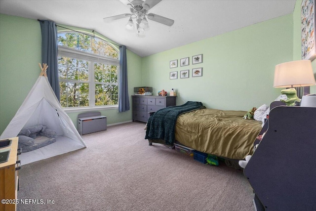bedroom featuring carpet flooring, lofted ceiling, and a ceiling fan