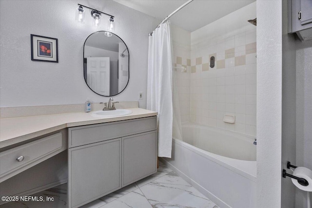 full bath with shower / bath combination with curtain, marble finish floor, and vanity