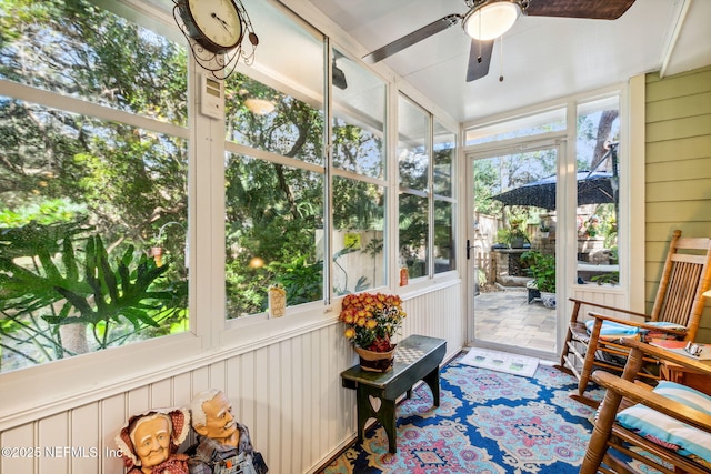 sunroom with a ceiling fan