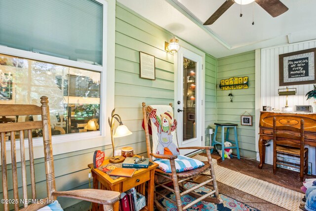 sunroom / solarium with ceiling fan