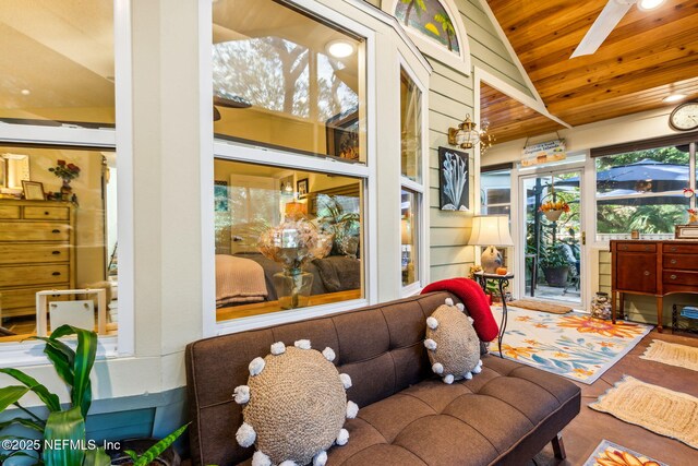 interior space with wood ceiling, vaulted ceiling, and wood finished floors