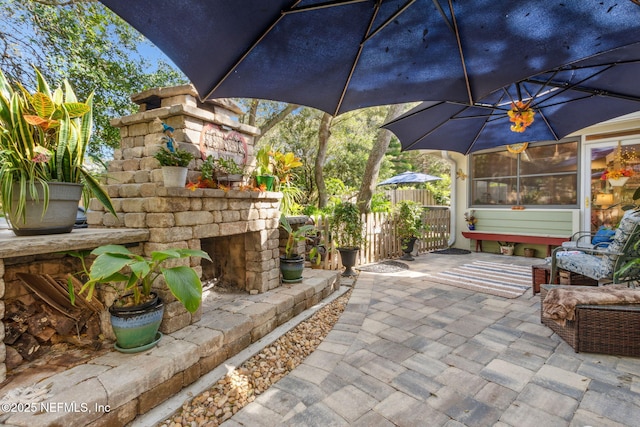 view of patio / terrace featuring fence