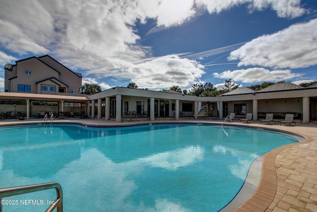 pool with a patio area
