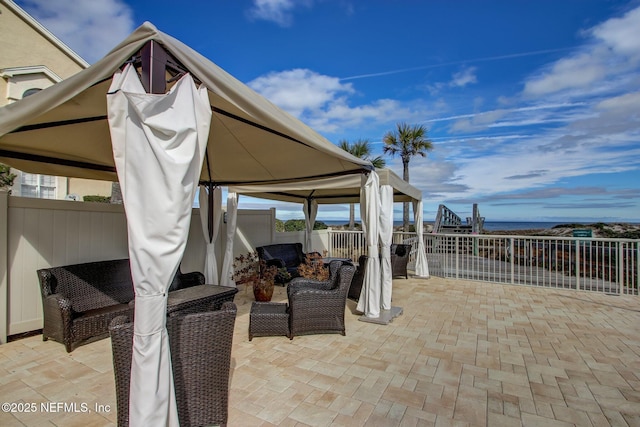 view of patio / terrace featuring a fenced backyard and a gazebo