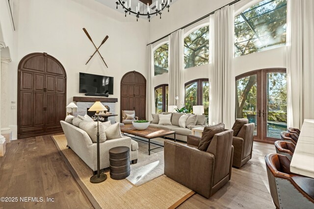 113 Cutter Ct, Ponte Vedra Beach, FL 32082 - living area with a high ceiling, a wealth of natural light, french doors, and hardwood / wood-style flooring