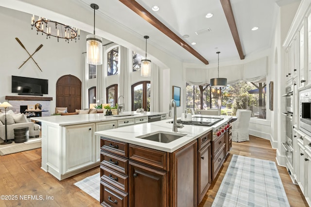 113 Cutter Ct, Ponte Vedra Beach, FL 32082 - kitchen with a sink, a wealth of natural light, beam ceiling, and an island with sink