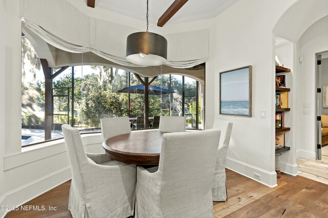 113 Cutter Ct, Ponte Vedra Beach, FL 32082 - dining space with wood-type flooring, arched walkways, baseboards, and beam ceiling
