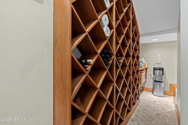 113 Cutter Ct, Ponte Vedra Beach, FL 32082 - wine room with baseboards and stone finish flooring