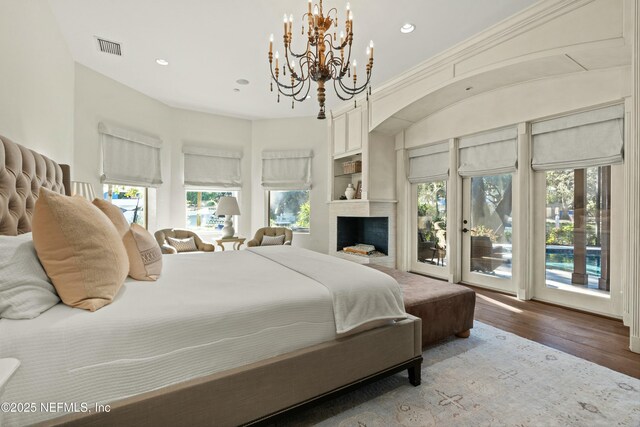 113 Cutter Ct, Ponte Vedra Beach, FL 32082 - bedroom with a notable chandelier, visible vents, access to exterior, and multiple windows