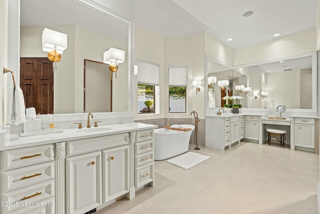 113 Cutter Ct, Ponte Vedra Beach, FL 32082 - bathroom with tile patterned flooring, a sink, a freestanding bath, and two vanities