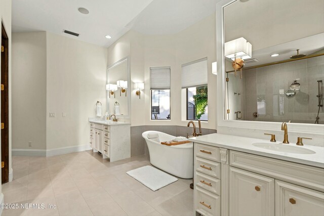 113 Cutter Ct, Ponte Vedra Beach, FL 32082 - bathroom featuring visible vents, a freestanding bath, tile patterned floors, a shower stall, and a sink