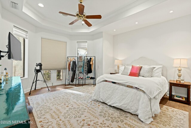 113 Cutter Ct, Ponte Vedra Beach, FL 32082 - bedroom featuring visible vents, crown molding, wood finished floors, recessed lighting, and a raised ceiling