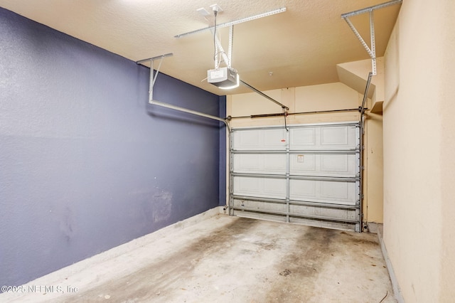 8539 Gate Pkwy W Unit 1121, Jacksonville, FL 32216 - garage featuring baseboards and a garage door opener