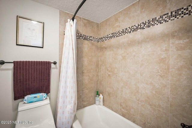 full bath with shower / bath combo with shower curtain, toilet, and a textured ceiling