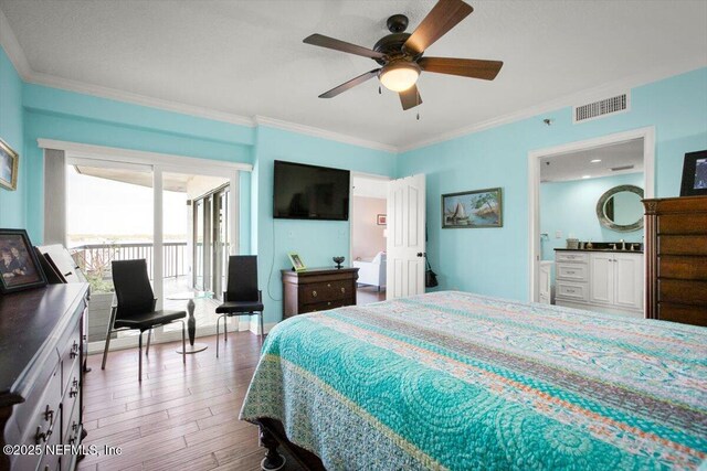 bedroom featuring wood finished floors, crown molding, access to outside, and visible vents