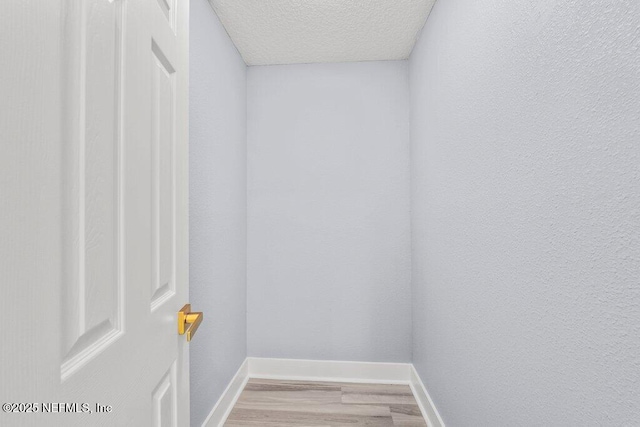 4488 Turner Ave, Jacksonville, FL 32207 - interior space with a textured ceiling, baseboards, and wood finished floors