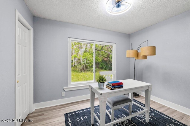 4488 Turner Ave, Jacksonville, FL 32207 - office area with baseboards, a textured ceiling, and light wood-style flooring