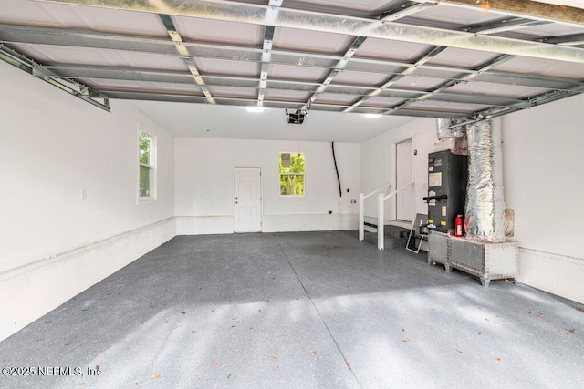 4488 Turner Ave, Jacksonville, FL 32207 - garage featuring water heater and a garage door opener