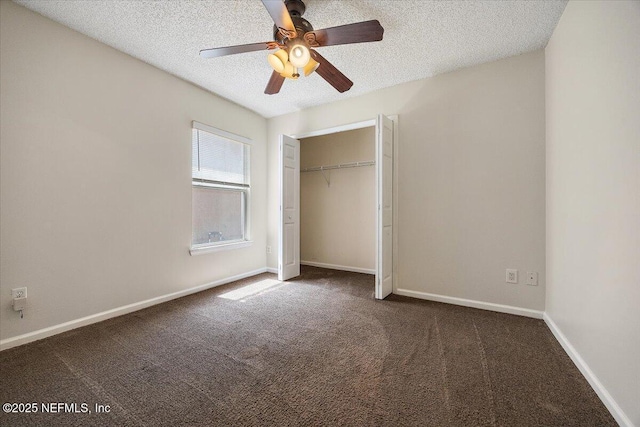 unfurnished bedroom featuring carpet floors, a textured ceiling, baseboards, and a closet