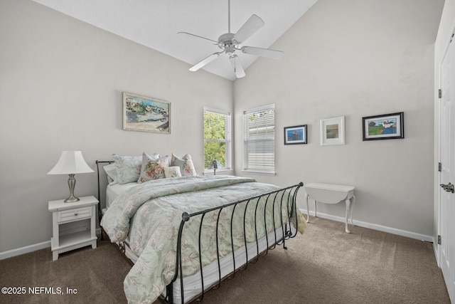 carpeted bedroom featuring baseboards, ceiling fan, and high vaulted ceiling